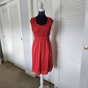 Max Studio sleeveless knee length orange dress with Smocking. Size M
